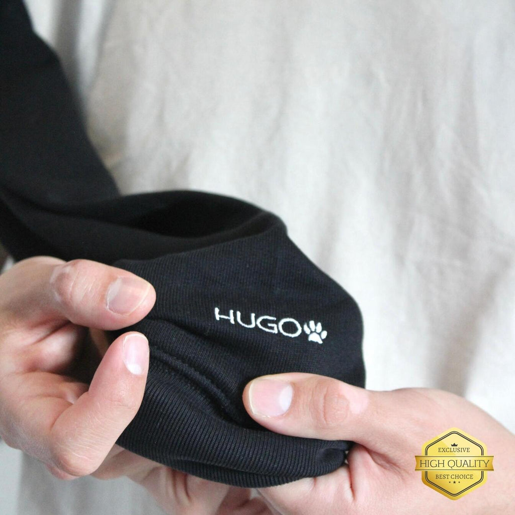 Black sock with 'HUGO' branding held by hands against a neutral background