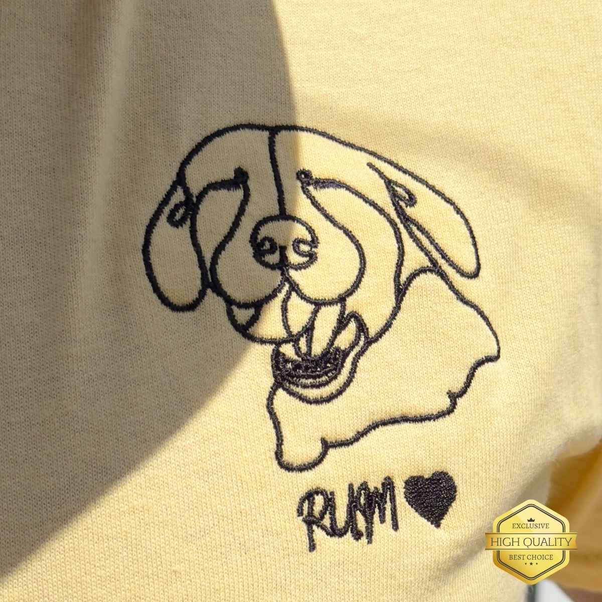 Embroidered dog design on a beige fabric with 'RUM' text.